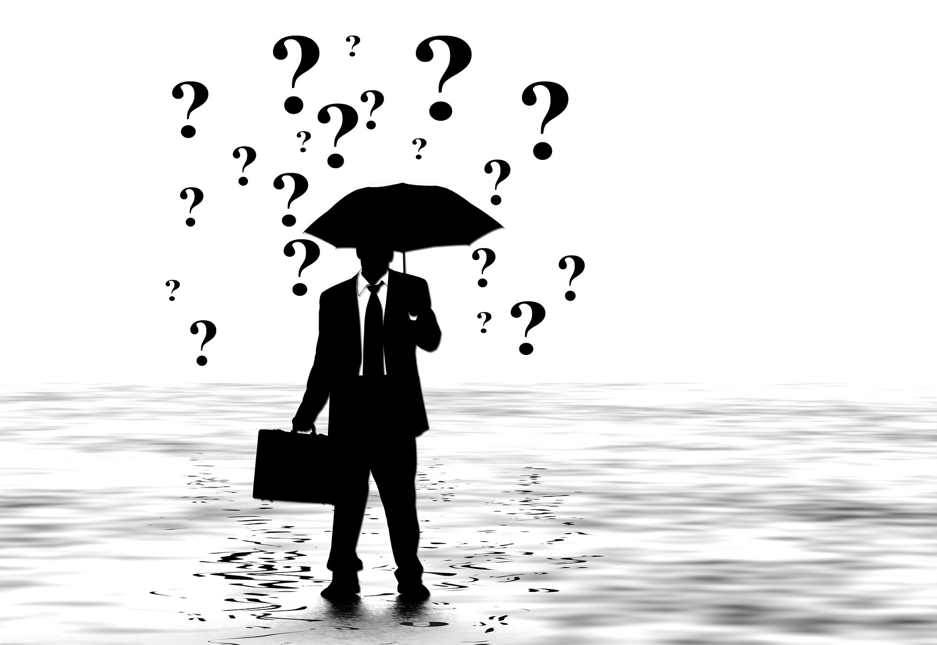 A person using an umbrella with question marks in the background
