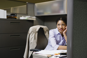 Productivity Tips: Woman Thinking on Her Cubicle