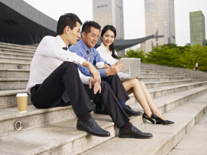 3 people doing a meeting outdoors