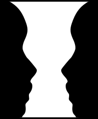 Silhouette of two people facing each other