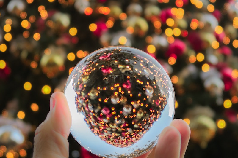 Looking at a Christmas tree through a glass globe