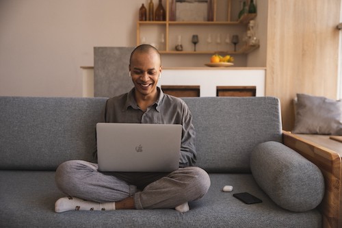 Man working on the couch