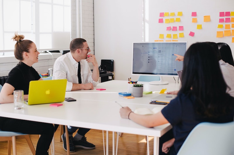 Team members listening during a presentation