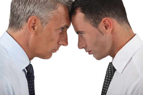 Two people doing a headbutt to each other