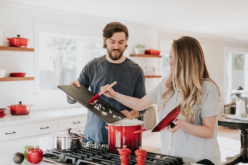 Two people cooking