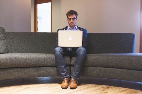 A person working on the couch