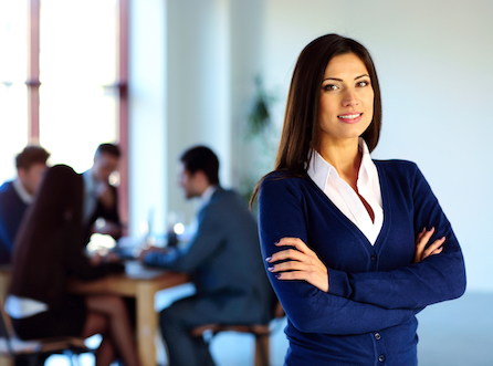 An executive posing with her arms crossed