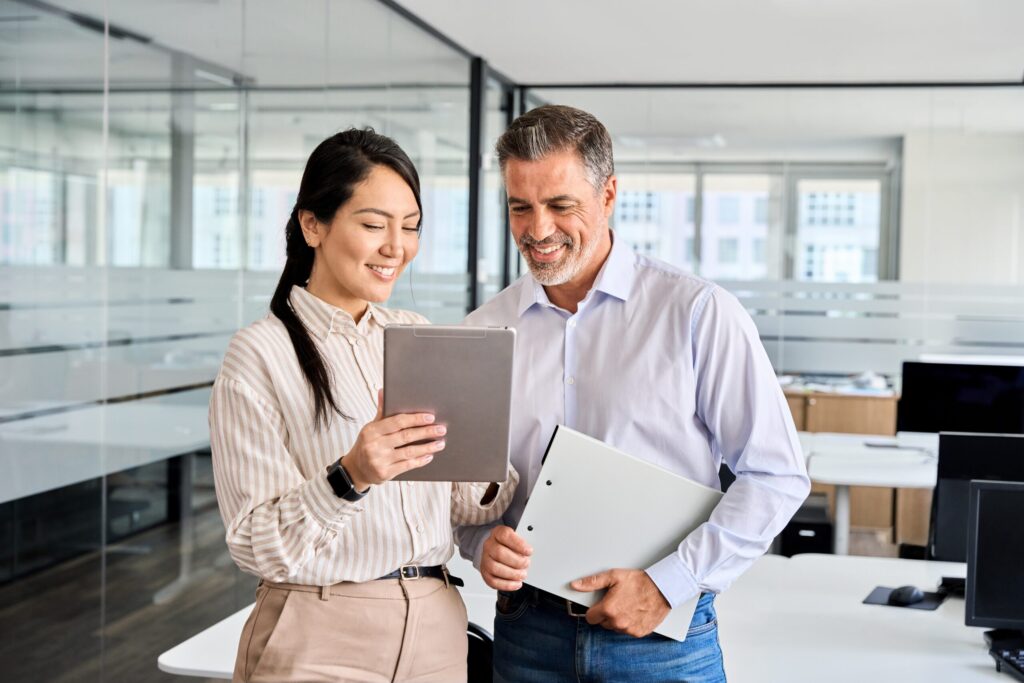 Two business people looking at a tablet