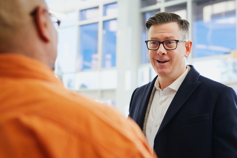 Two men talking about business