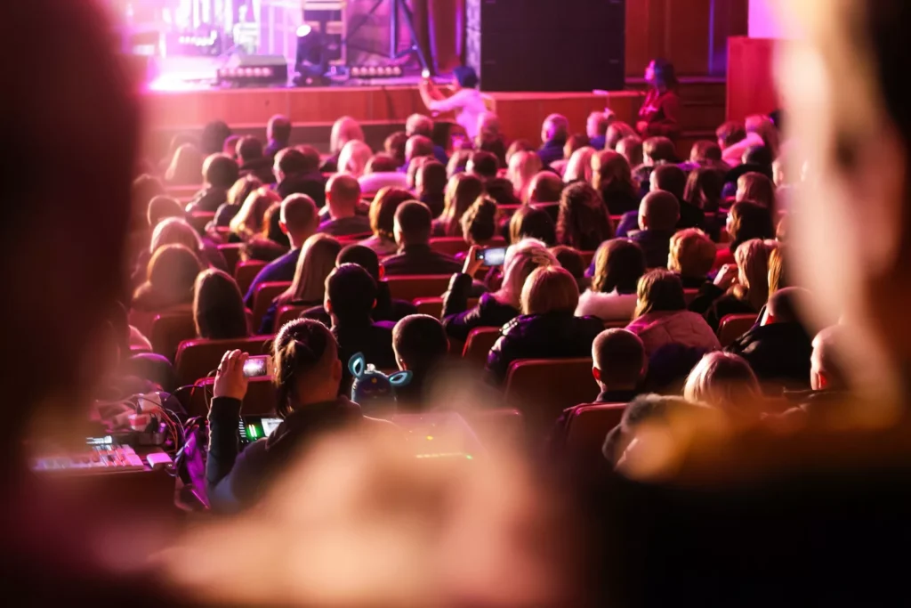 Spectators Sit In The Hall