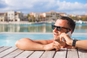 A person in a swimming pool calling on his phone