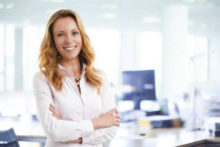 businesswoman standing with crossed arms