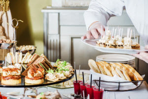 A chef arranging the food