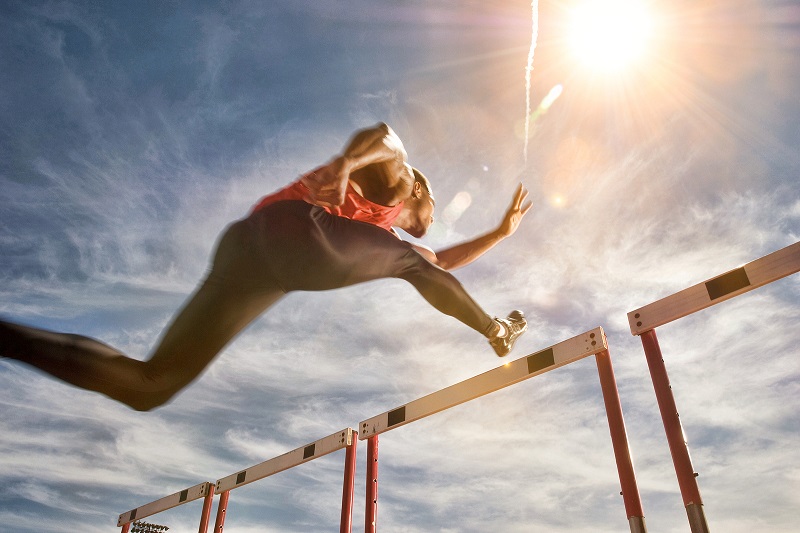 An athlete jumping in a hurdle
