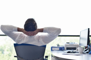 A worker relaxing in his office chair