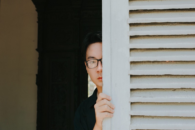 A man hiding in the corner