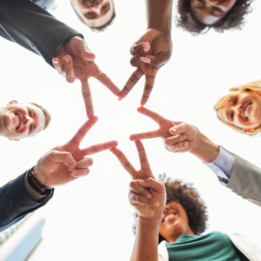 people in group making-hand sign