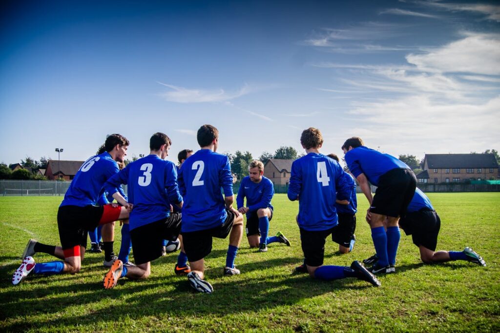 Soccer team kneeling around