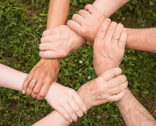People holding each other's wrists
